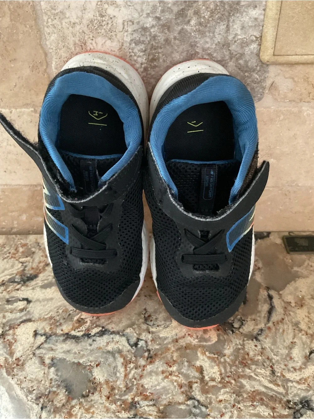 New Balance Kids Black Sneakers with Blue Lining and Coral Accent